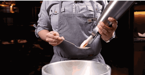 Use a cream charger to make smoking ice cream